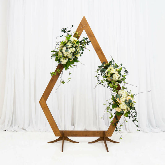 Diamond-shaped wooden arch rental adds unique style to outdoor and indoor wedding backdrops in Atlanta, GA .