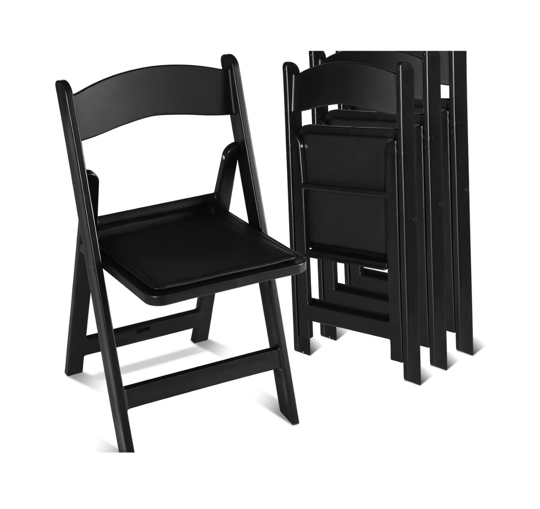 White resin chairs stacked for ceremony seating event decor rental in Atlanta, GA